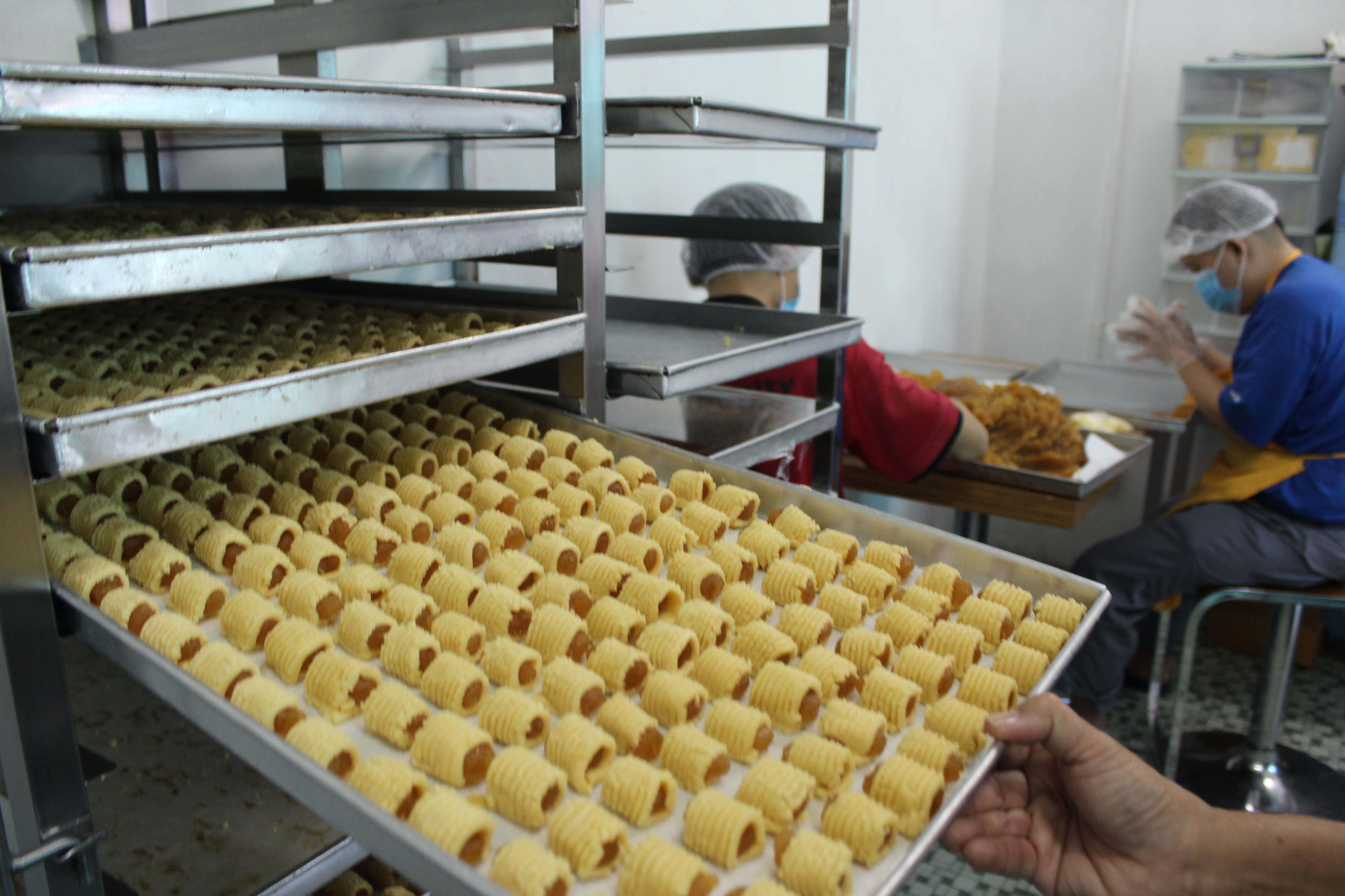 Rojak Daily/Zoe Liew Rolling thousands of pineapple tarts is no easy feat.